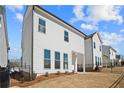 Exterior showcasing white siding, black trim and fenced yard, offering a clean and modern aesthetic at 633 Skytop Dr, Cumming, GA 30040