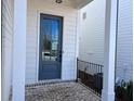 Close-up of a modern front door with a glass window, set in a brick-paved entryway of a new home at 635 Skytop Dr, Cumming, GA 30040