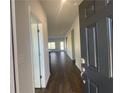 Bright entry hall with hardwood floors and views into the living room at 4555 Sweetlake Ct, Mableton, GA 30126