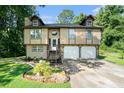 Two-story house with a double garage and well-maintained landscaping at 2641 Short Trl, Lithia Springs, GA 30122