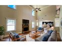 Open concept living room and kitchen with stone fireplace, high ceilings and lots of windows provide plenty of natural light at 932 Nestling Dr, Lawrenceville, GA 30045