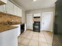 A spacious kitchen with white cabinetry, granite countertops, and modern appliances at 1012 Burns Dr, Atlanta, GA 30310