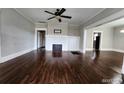 Bright living room with beautiful wood floors, a fireplace, and neutral walls at 1012 Burns Dr, Atlanta, GA 30310