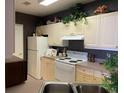 Bright kitchen with white appliances and ample cabinetry at 3334 Peachtree Ne Rd # 1110, Atlanta, GA 30326
