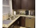 Kitchen featuring granite countertops, stainless steel appliances, and dark cabinets at 2121 Arlington Ne Ave, Atlanta, GA 30324