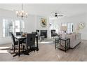 Open living space with fireplace, dining area, and ample natural light at 3315 Stillwood Ln, Atlanta, GA 30354