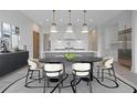 Elegant dining room with modern light fixtures and view of the open concept kitchen with stainless steel appliances at 8200 Main St # 1206, Woodstock, GA 30188