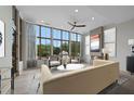 Bright living room featuring a fireplace, large windows, and comfortable seating at 8200 Main St # 1206, Woodstock, GA 30188