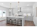 Bright kitchen with quartz countertops, stainless steel appliances, and stylish pendant lighting at 3324 Springhaven Ave, Atlanta, GA 30354
