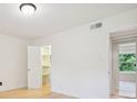 A bright bedroom with hardwood floors, offering ample storage and a natural light at 1261 Lavista Rd # F-3, Atlanta, GA 30324