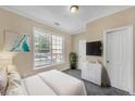 Cozy bedroom with a large window and neutral tones, offering a relaxing and comfortable space at 194 Riverstone Commons Cir, Canton, GA 30114