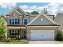 Beautiful two-story home with brick accents, a two-car garage, and a manicured front lawn at 160 Avery Landing Way, Canton, GA 30115