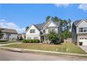 Two-story house with gray siding, stone accents, and a landscaped lawn at 2535 Grayton Loop, Villa Rica, GA 30180