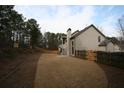 View of the backyard with a newly installed fence surrounding the property at 2170 Indian Ivey Ln, Dacula, GA 30019