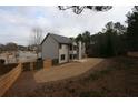 An angled view of the backyard showcasing the spacious lawn and wooden fence at 2170 Indian Ivey Ln, Dacula, GA 30019