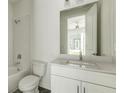 Bright bathroom with a toilet, shower, and vanity with a white countertop at 2029 Memorial Dr # 34, Atlanta, GA 30317