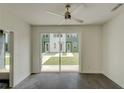 Bright bedroom with ceiling fan and sliding glass door overlooking backyard lawn at 2029 Memorial Dr # 34, Atlanta, GA 30317