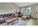 Relaxing living room with hardwood floors, ample seating, and large windows at 3004 Hidden Lake Dr, Duluth, GA 30096