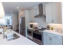 Elegant kitchen featuring stainless steel appliances, stylish countertops, and ample cabinet space at 628 Skytop Dr # 158, Cumming, GA 30040
