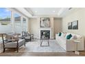 Inviting living room featuring a fireplace, stylish seating, and plenty of natural light at 248 Persimmon Dr, Holly Springs, GA 30115