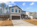 Charming two-story home with brick and siding, a well-manicured lawn, and a two-car garage at 111 Henley St, Canton, GA 30114