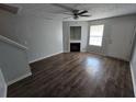 View of the living room with a fireplace and wood-look flooring at 500 Mica Trce, South Fulton, GA 30349