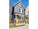 Stylish home with a covered porch, gray siding, and crisp, white window trim at 1095 Tucker Ave # 401, Atlanta, GA 30310