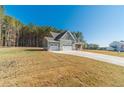 Side view of house highlighting the garage at 125 Pinewood Dr, Covington, GA 30014