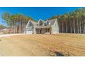 House exterior showcasing a three-car garage at 125 Pinewood Dr, Covington, GA 30014