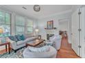 Bright living room featuring a fireplace, hardwood floors, comfortable seating, and elegant decor at 3621 Vinings Slope Se # 3202, Atlanta, GA 30339