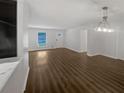 Bright living area featuring new dark floors and ample natural light at 720 Smithstone Se Rd, Marietta, GA 30067