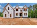 Modern kitchen with white cabinets, large island, and gold accents at 2675 Drayton Hall Dr, Buford, GA 30519