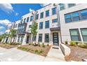Modern townhome exterior with brick facade, dark trim, and inviting entryways at 550 Whitlox Nw Rd, Atlanta, GA 30318