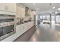 Well-equipped kitchen featuring stainless steel appliances, granite countertops, and white cabinetry at 550 Whitlox Nw Rd, Atlanta, GA 30318