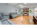 Spacious living room featuring a stone fireplace, hardwood floors, and vaulted ceiling at 626 Dover St, Marietta, GA 30066