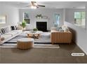 Bright living room with a fireplace, plush seating, and stylish decor at 3227 Diamond Blf, Union City, GA 30291