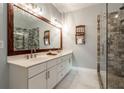 Bathroom boasts double vanity, walk-in shower, and large mirror at 7655 Abbey Glen Dr, Cumming, GA 30028