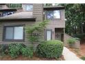 Exterior view of 2 story townhome with landscaping at 102 Cedar Chase Rd, Atlanta, GA 30324