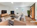 Bright living room showcasing a cozy fireplace, neutral furnishings, and a stylish striped rug at 741 Prince Ave, Marietta, GA 30062