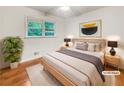 Serene bedroom with a modern headboard, stylish bedside tables, and a calming color palette at 741 Prince Ave, Marietta, GA 30062