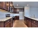 Well-lit kitchen with modern appliances, granite countertops, and ample cabinet space at 6198 Ripple Way # 87, South Fulton, GA 30349