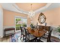 Elegant dining room features a chandelier, large mirror, and plenty of natural light at 4055 Vinings Mill Se Trl, Smyrna, GA 30080
