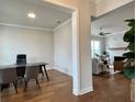 Bright home office with hardwood floors and built-in desk at 500 Pearl St, Cumming, GA 30040