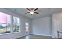 Bright living room with large windows providing natural light and views of the outside at 6214 Ripple Way # 91, South Fulton, GA 30349