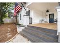 Inviting front porch with a porch swing and wooden floor at 1738 Hosea L Williams Ne Dr, Atlanta, GA 30317