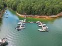 Scenic aerial view of the community boat dock and serene lake, offering convenient access for boating enthusiasts at 3200 Rim Cove Dr # 192, Cumming, GA 30041