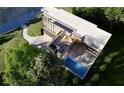 Aerial view of a modern home, outdoor deck, and pool at 753 Crestridge Ne Dr, Atlanta, GA 30306