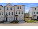 Charming townhomes with modern facades, private garages, and beautifully landscaped surroundings at 3136 Washburn Se St, Atlanta, GA 30354