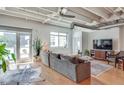 Stylish living area with hardwood floors, modern decor, and large windows offering ample natural light at 805 Peachtree Ne St # 401, Atlanta, GA 30308