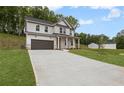 A beautiful two-story home with a long driveway, two-car garage, and a well-kept lawn at 404 Beacon Way, Villa Rica, GA 30180